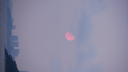 Full moon rising over sea at Pataya city Thailand.の写真素材