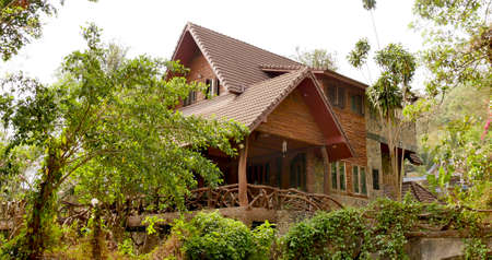 March 18 2021 - Ratchaburi, Thailand : Front of  rural house surrounded by trees in countryside, Suanphueng, Ratchaburi, Thailand.のeditorial素材