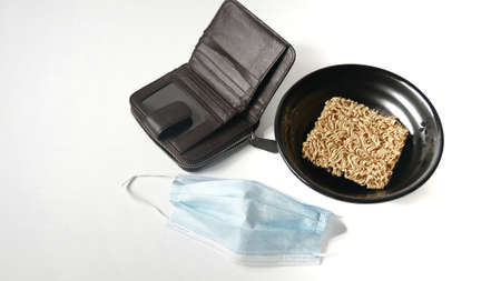Instant noodles, surgical mask and empty wallet, poverty during the epidemic