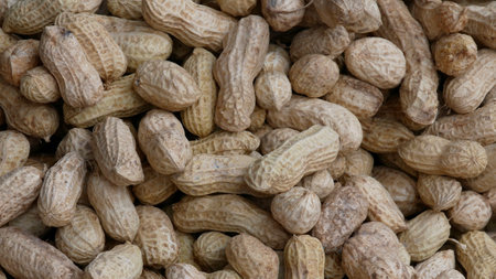 Background of peanut in shell,  heap of raw peanut in market.