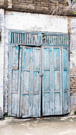 Old and weathered wooden door, Vintage background of old wooden door.の写真素材