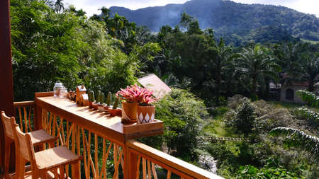 Beautiful outdoor terrace with chairs on the sunny day with mountain views.の写真素材
