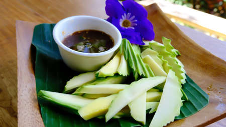 Mangoes sour and sweet sauce mix with dried shrimp, popular Thai traditional dessert.の写真素材
