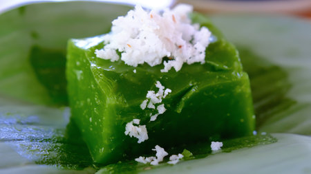 Close up pandanus pudding with coconut topping on banana leaf, Thai traditional dessert.の写真素材