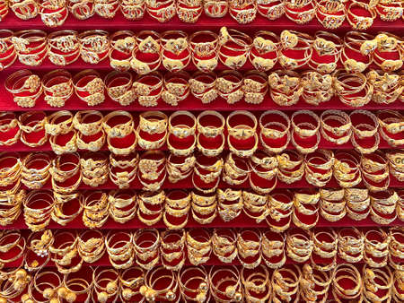 Top view beautiful gold rings on display in store.