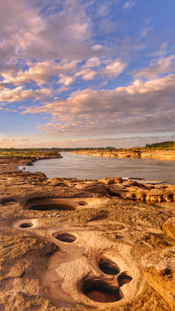"Sam Pun Bok" Three thousand waving the rocks beneath the Mekong river. Natural sandstone group Eroded through time for thousands of years. Thailand grand canyon in Ubon Ratchathani.の写真素材