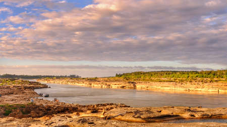 Sam Pun Bok Three thousand waving the rocks beneath the Mekong river. Natural sandstone group Eroded...