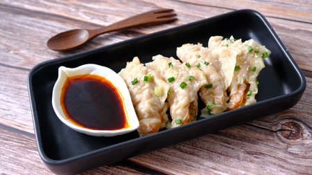 Top view  steam shrimp dumplings with soy sauce (gyoza or dim sum).の写真素材