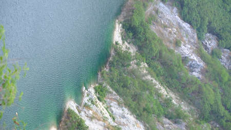 Landscape view of deep abandoned mine containing and emerald green lake, Grand canyon kiri, Chonburi, Thailand.の写真素材