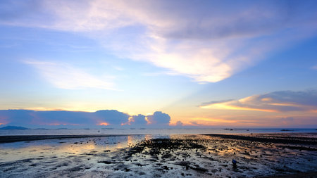 Sunset beach landscape, sea horizon at sunset, dramatic sunset colour.の写真素材