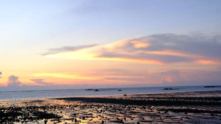 Sunset beach landscape, sea horizon at sunset, dramatic sunset colour.の写真素材