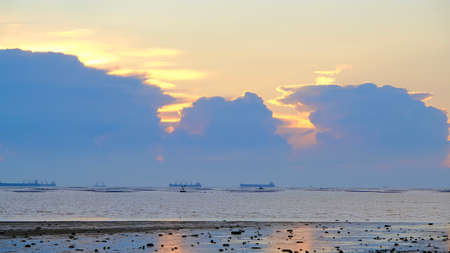Sunset beach landscape, sea horizon at sunset, dramatic sunset colour.の写真素材