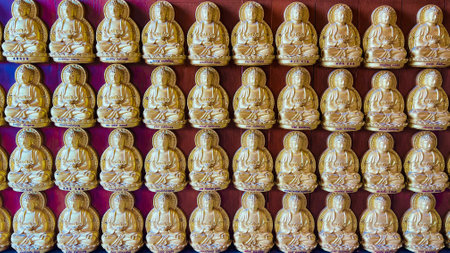 January 22 2023 - Nonthaburi, Thailand : Small Buddha statues on the wall at Wat Boromracha Kanchanapisek Anusorn (or Wat Leng Noei Yi 2).のeditorial素材