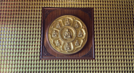 January 22 2023 - Nonthaburi, Thailand : Small Buddha statues on the wall at Wat Boromracha Kanchanapisek Anusorn (or Wat Leng Noei Yi 2).のeditorial素材