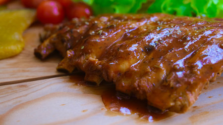 Selective focus grill pork ribs on wooden board.の写真素材