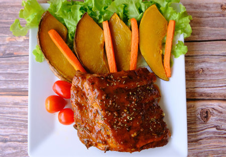 Table top view grilled and smoked pork ribs with on wooden board.の写真素材