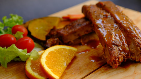 Selective focus grill pork ribs on wooden board.の写真素材