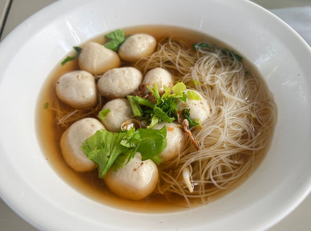 Top view table rice vermicelli noodle soup with pork ballsの写真素材