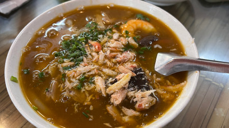 Vietnamese pho bo with seafood  in gravy soup.の写真素材