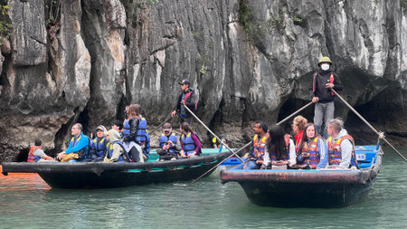 December`-17-2022 : Ha Long Bay , Vietnam : Tourist enjoy boat sightseeing around the islands on  Ha Long Bay.のeditorial素材