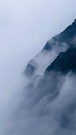 Spectacular view top of mountain surrounded with clouds. Amazing peak in clouds.の写真素材