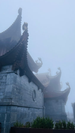 Sa Pa, Lao Cai, Vietnam â December 14, 2022 : Buddhist temple at Fansipan mountain in the foggy day.のeditorial素材