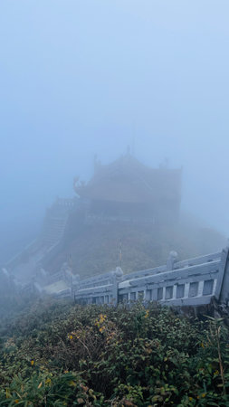 Sa Pa, Lao Cai, Vietnam â December 14, 2022 : Buddhist temple at Fansipan mountain in the foggy day.のeditorial素材