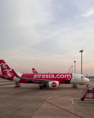 Bangkok, Thailand - November 14, 2022 : Air Asia Airplane Being parked waiting for passengers at Don Mueang Airport. Bangkok.のeditorial素材