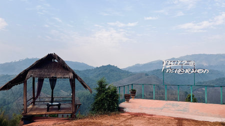 Scenic view of wooden pavilion on top of mountain with Thai word mean hill and mist.の写真素材