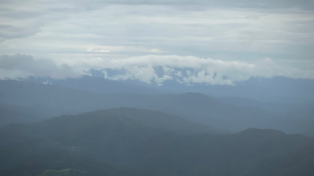 Scenic view of  misty mountain in rain  season at  Doi Pha Hee, Chiang Rai, Thailand.の写真素材