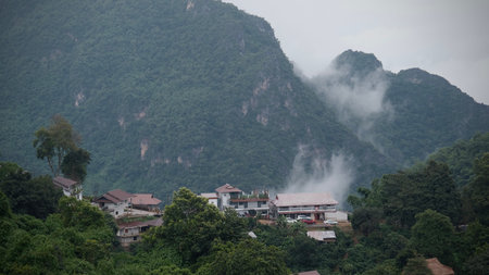 Scenic view of  misty mountain in rain  season at  Doi Pha Hee, Chiang Rai, Thailand.の写真素材