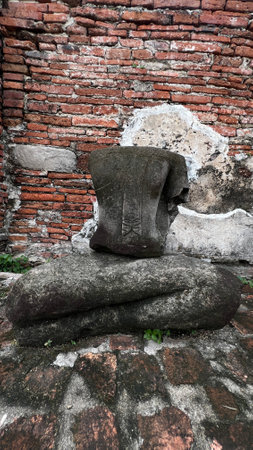 Headless buddha statue at Wat Mahathat historical park in Ayuttaya.の写真素材