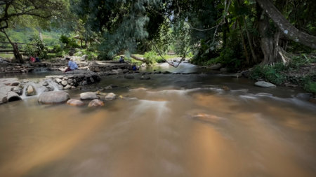 Long exposure and blurred hot spring creek at Chaeson National Park, Lampang province, Thailand.の写真素材