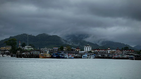 Approaching storm cloud with rain over the sea.の写真素材