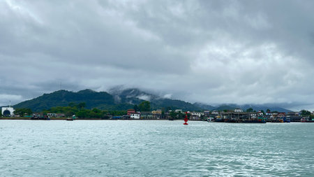 Approaching storm cloud with rain over the sea.