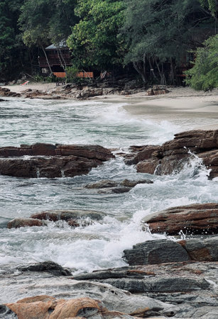 Sea waves splash to rocks on a coast, Sea waves hitting rocks on the beach.の写真素材