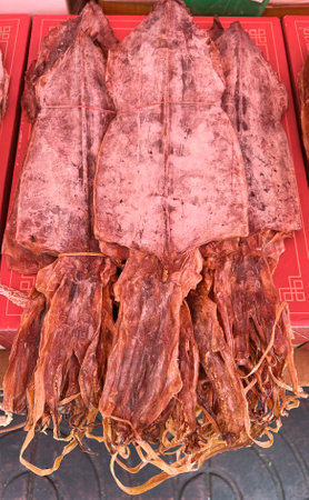 Dried squid  in local street food market.の写真素材