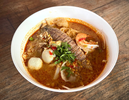 Top view table spicy mixed seafood noodle. (tom yum crayfish, shrimp, fish ball)の写真素材
