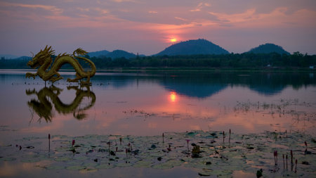 Beautiful view of golden dragon at sunset the landmark of Ang kep nam chat pa wai view point in Suanpueng, Ratchaburi province.の写真素材