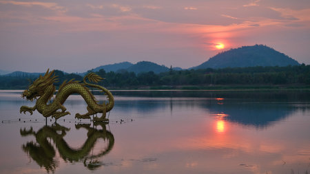 Beautiful view of golden dragon at sunset the landmark of Ang kep nam chat pa wai view point in Suanpueng, Ratchaburi province.の写真素材