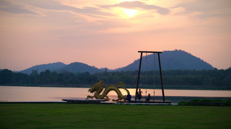 Beautiful view of golden dragon at sunset the landmark of Ang kep nam chat pa wai view point in Suanpueng, Ratchaburi province.の写真素材