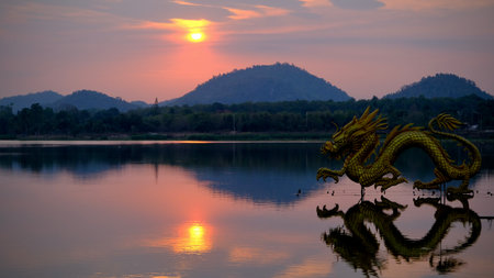 Beautiful view of golden dragon at sunset the landmark of Ang kep nam chat pa wai view point in Suanpueng, Ratchaburi province.の写真素材