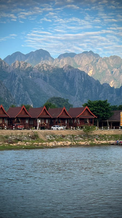 Wooden houses on the bank of the river in Laosの写真素材