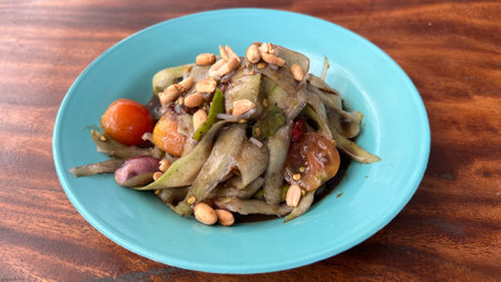 Table top view Luang Prabang papaya salad isolated on wooden background.の写真素材