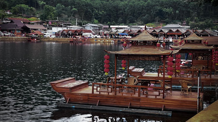 Traditional wooden boat on the lake Ban Rak Thai, Mae Hong Son, Thailand.の写真素材