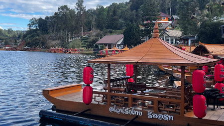 Tourist boat on the lake in at Ban Rak Thai, Mae Hong Son, Thailand.の写真素材