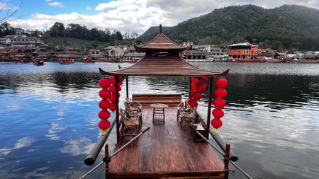 Traditional wooden tourist boat on the lake at Ban Rak Thai, Mae Hong Son, Thailand.の写真素材