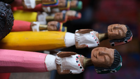 Wooden dolls Kayan women with traditional brass neck rings, the handcrafted cultural souvenirs from...