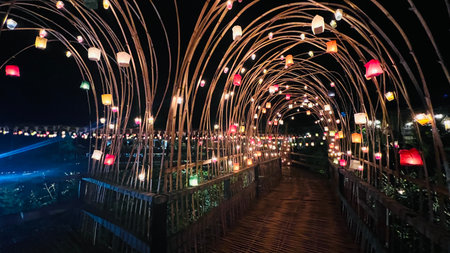 Colorful candlelight decoration on bamboo bridge at night, Baan Hom Thian, Ratchaburi, Thailandの写真素材