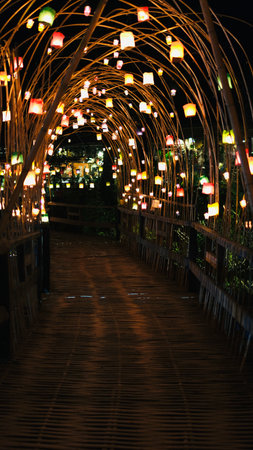 Colorful candlelight decoration on bamboo bridge at night, Baan Hom Thian, Ratchaburi, Thailandの写真素材